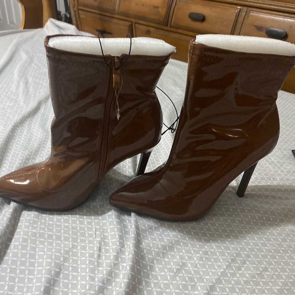 Boots from Torrid. Never worn, the tag fell off but boots are brand new.
